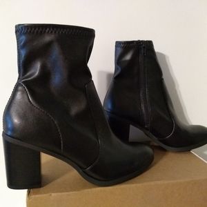 Sleek black heeled boots